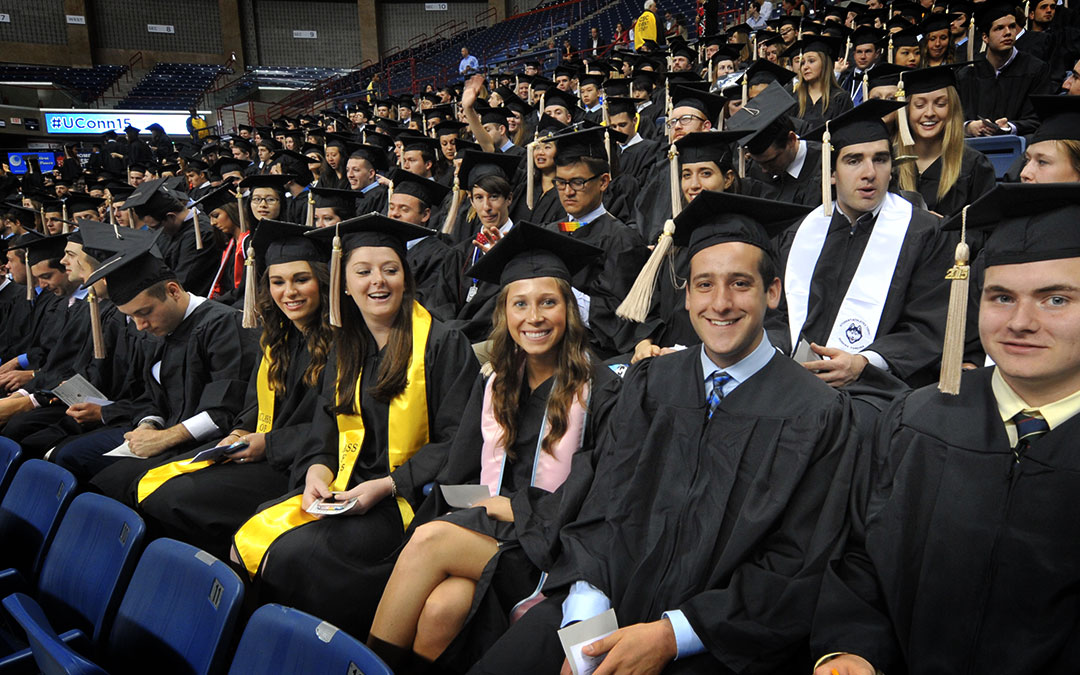 The Class of 2015 is all smiles as the students wait to receive their degrees.