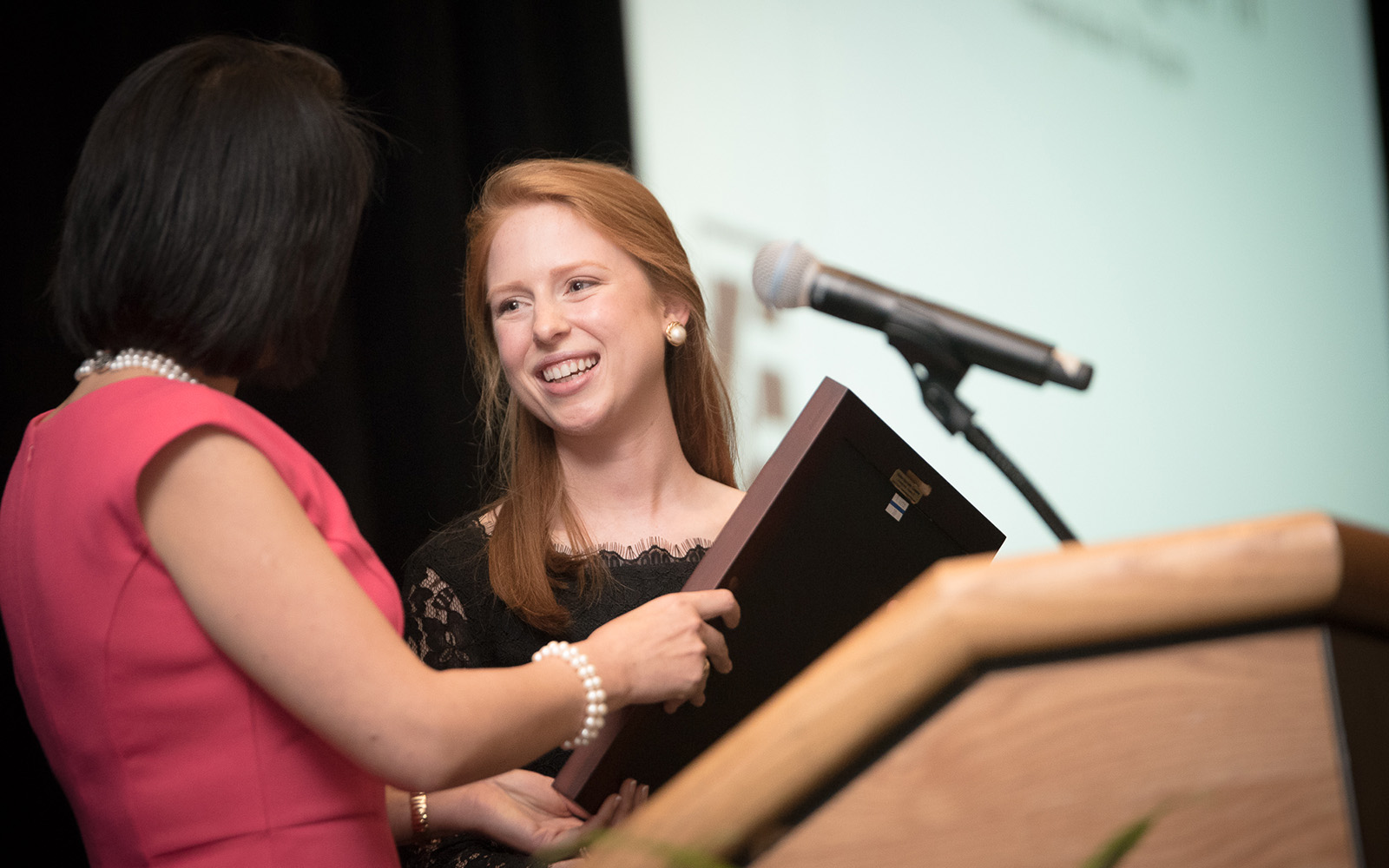 Associate Dean of Research Sulin Ba presents Emily Vasington '16 with her Hall of Fame award. (Nathan Oldham/UConn School of Business)