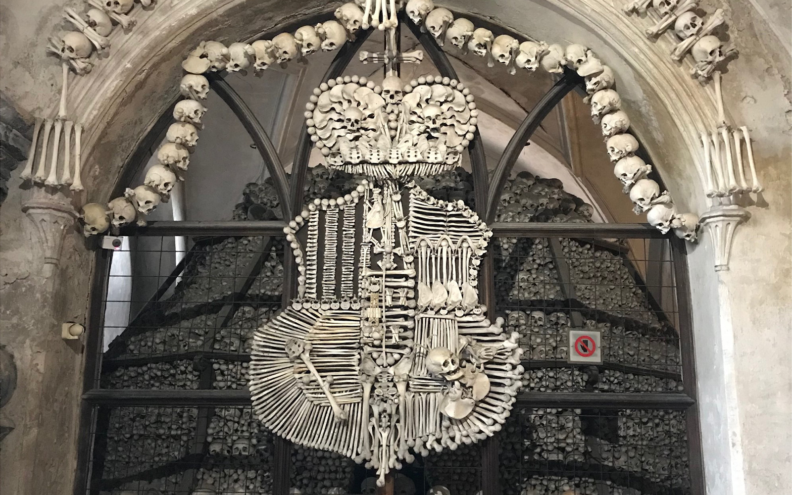 Coat of arms of the House of Schwarzenberg made out of human bones at Sedlec Ossuary. (Kasia Kolc / UConn School of Business)