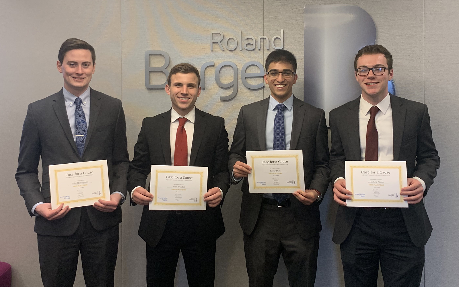 Left to right, John McLaughlin, John Brindisi, Keyur Shah, and Matthew Frank accepting their awards at the "Case for a Cause" competition (Photo courtesy of John McLaughlin)