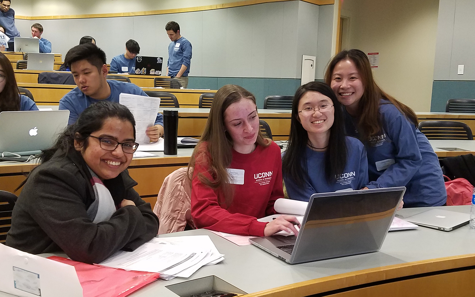 Volunteers prepared taxes for over 700 people this year in the VITA Program.  From left, graduate student Debadarshini Mishra, second-year reviewer Nicole Holyst and first-year preparers Jenny Wei and Qingya Yang.