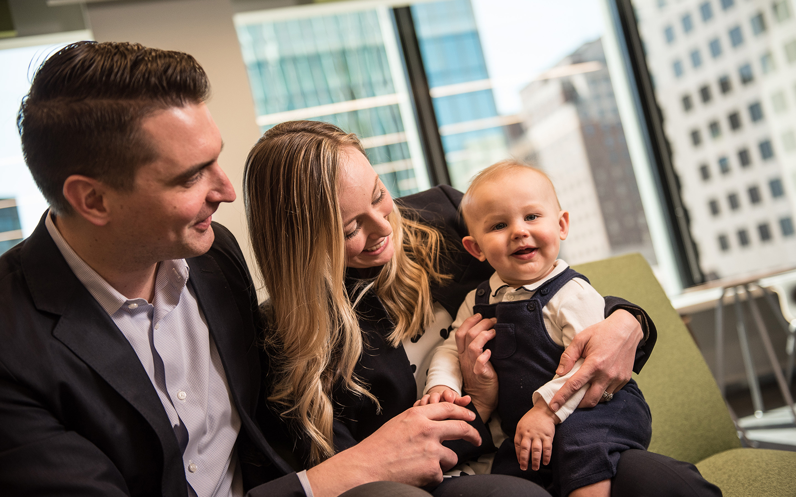 Chris DiGiacomo (left) and his wife Julie Marquis DiGiacomo (right) balanced work, marriage, and childbirth to earn their MBAs through UConn's PMBA program. (Nathan Oldham / UConn School of Business)