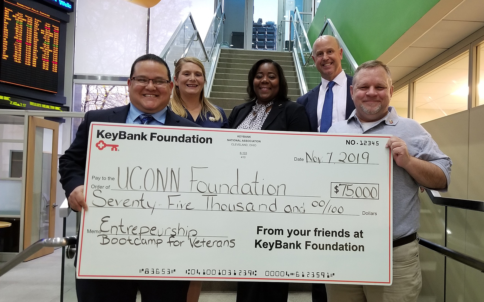 KeyBank has presented a $75,000 grant to the UConn School of Business’ Entrepreneurship Bootcamp for Veterans, which helps U.S. military veterans become small business owners. Pictured from left to right are UConn EBV program graduates Jorge and Jessica Rodriguez, KeyBank Corporate Responsibility Officer LaKisha Jordan, KeyBank Market President Jim Barger, and UConn  EBV Director Michael Zacchea. (Contributed Photo)