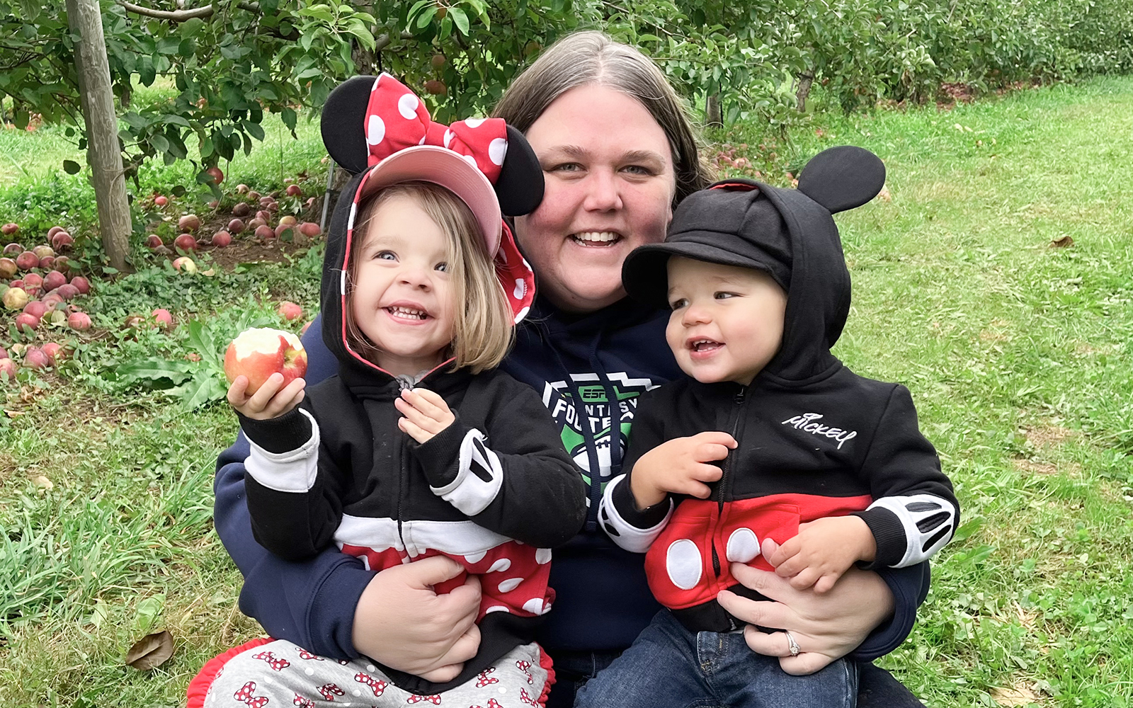 Jenny posing with her two children, decked out in Disney regalia (Contributed Photo)