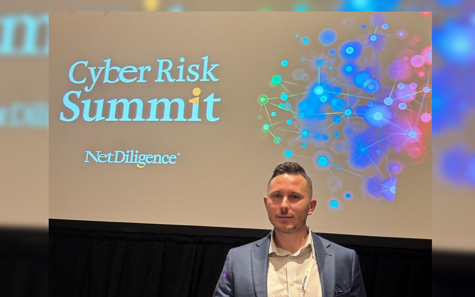 Graduate student Nick Savignano ’25 at the CyberRisk Summit. Contributed Photo)