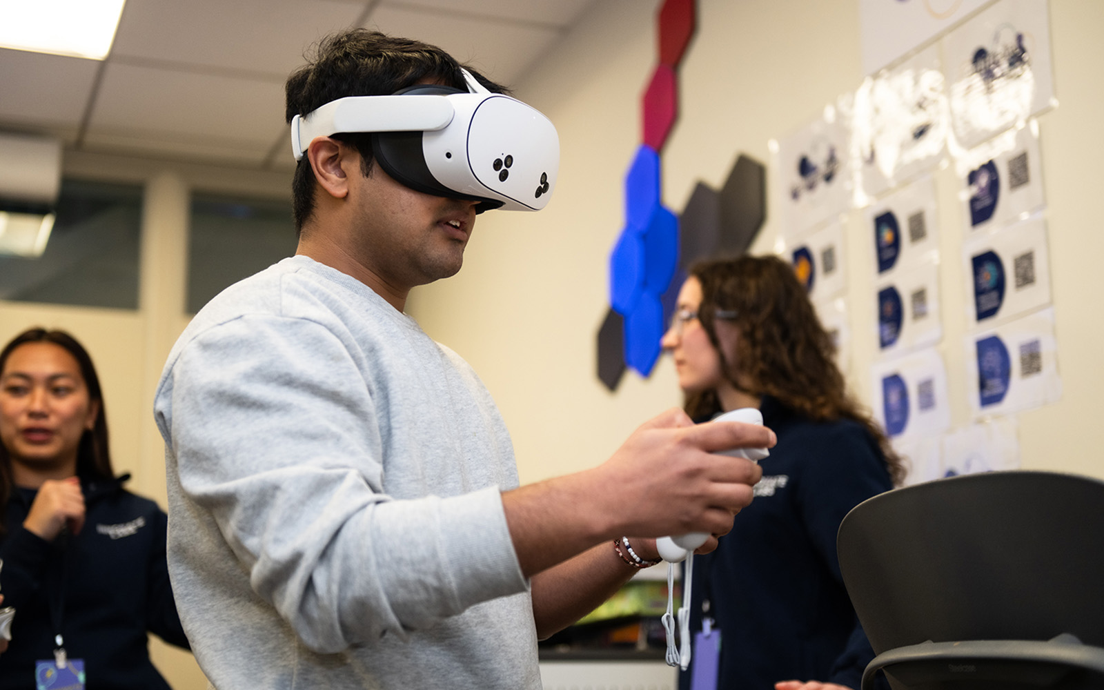 Graduate student Pranay Khare tests on the VR technology (Nathan Oldham / UConn School of Business)