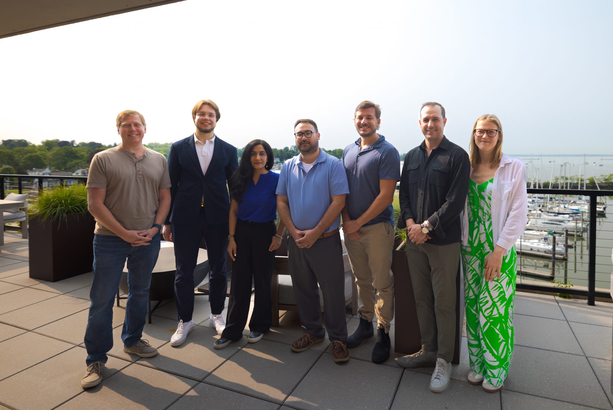 • Members of the BittBridge team met in Stamford on Wednesday. Pictured from left: Barry Silbert, Founder and CEO, Yuma and DCG; Dmitrii Tuzov, Faeze Safari, and Jon Rohardjo, UConn graduate students; professor Dave Wanik, BittBridge advisor; alumnus Evan Malanga '10, Chief Revenue Officer at Yuma; and Lindsay Stone, Director of Program Management at Yuma.