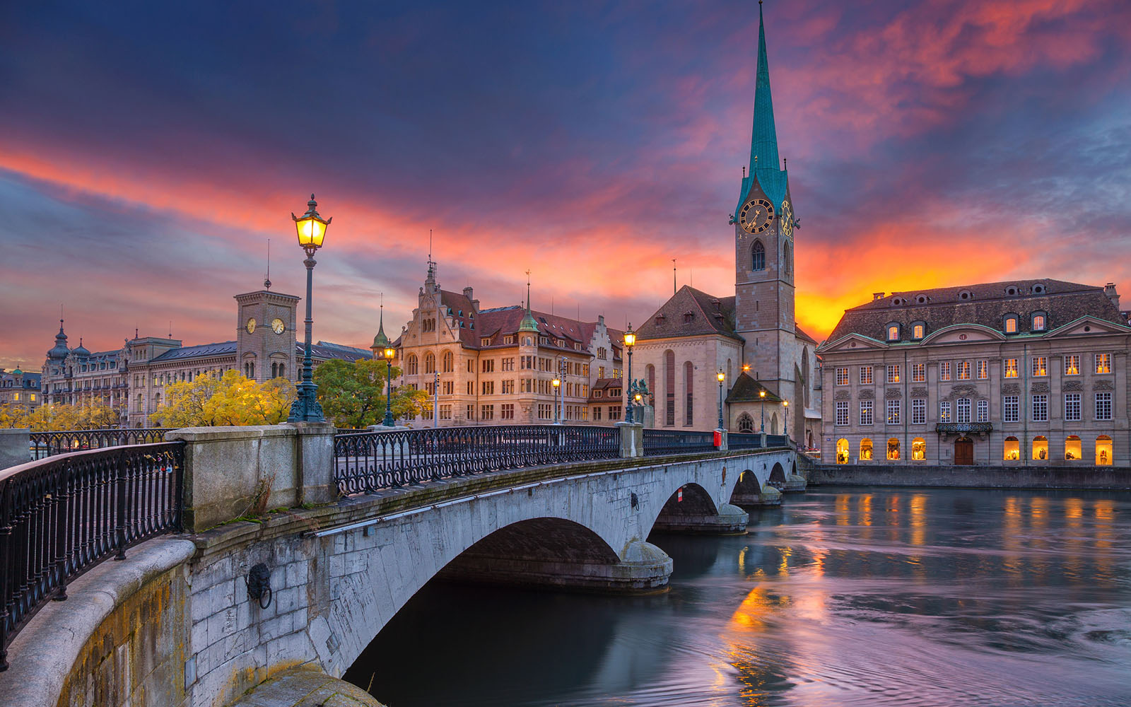 Cityscape image of Zurich, Switzerland during dramatic sunset.
